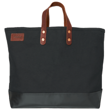 Black canvas tote bag with leather handles