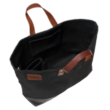 Black canvas tote bag with leather handles